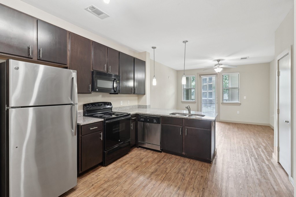Spacious Upgraded Kitchen Appliances and Cabinets at District at Medical Center, San Antonio