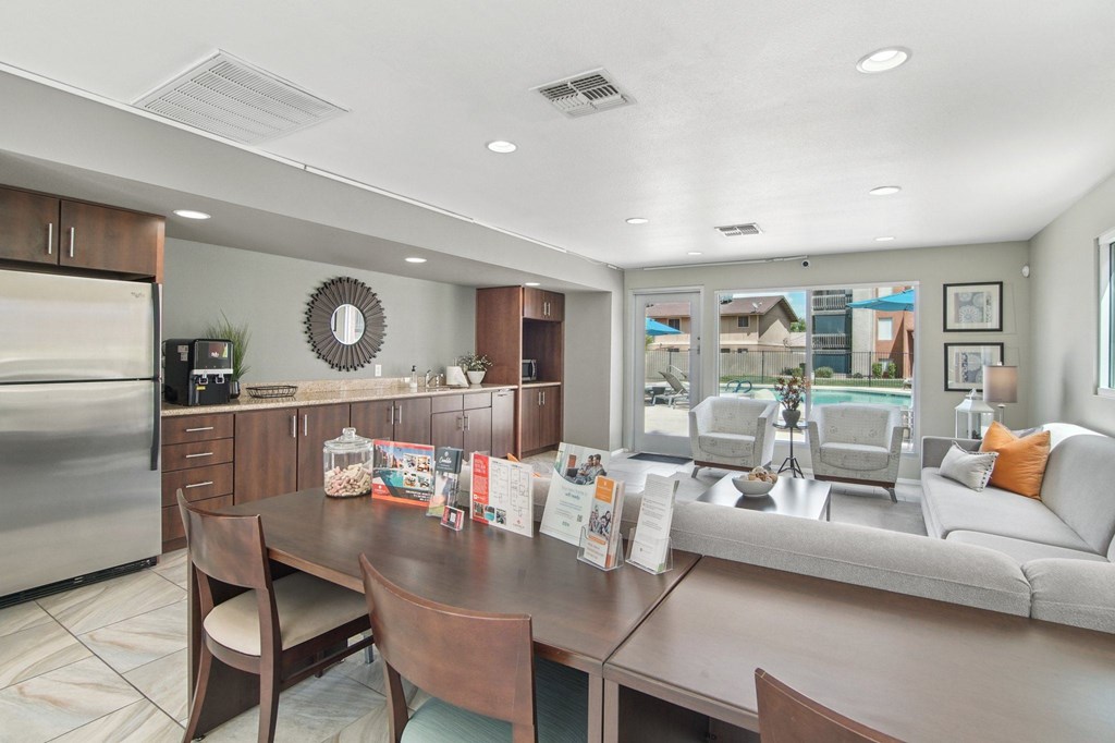 A modern kitchen with a dining table and chairs at Candela Park Apartments, Arizona, 85201