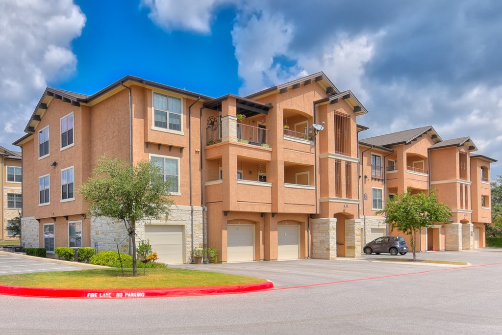 Exterior View of Buildings with Garages at Mission Hills Apartments, San Antonio, TX