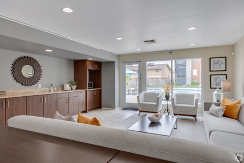 A living room with a white couch and a coffee table.
