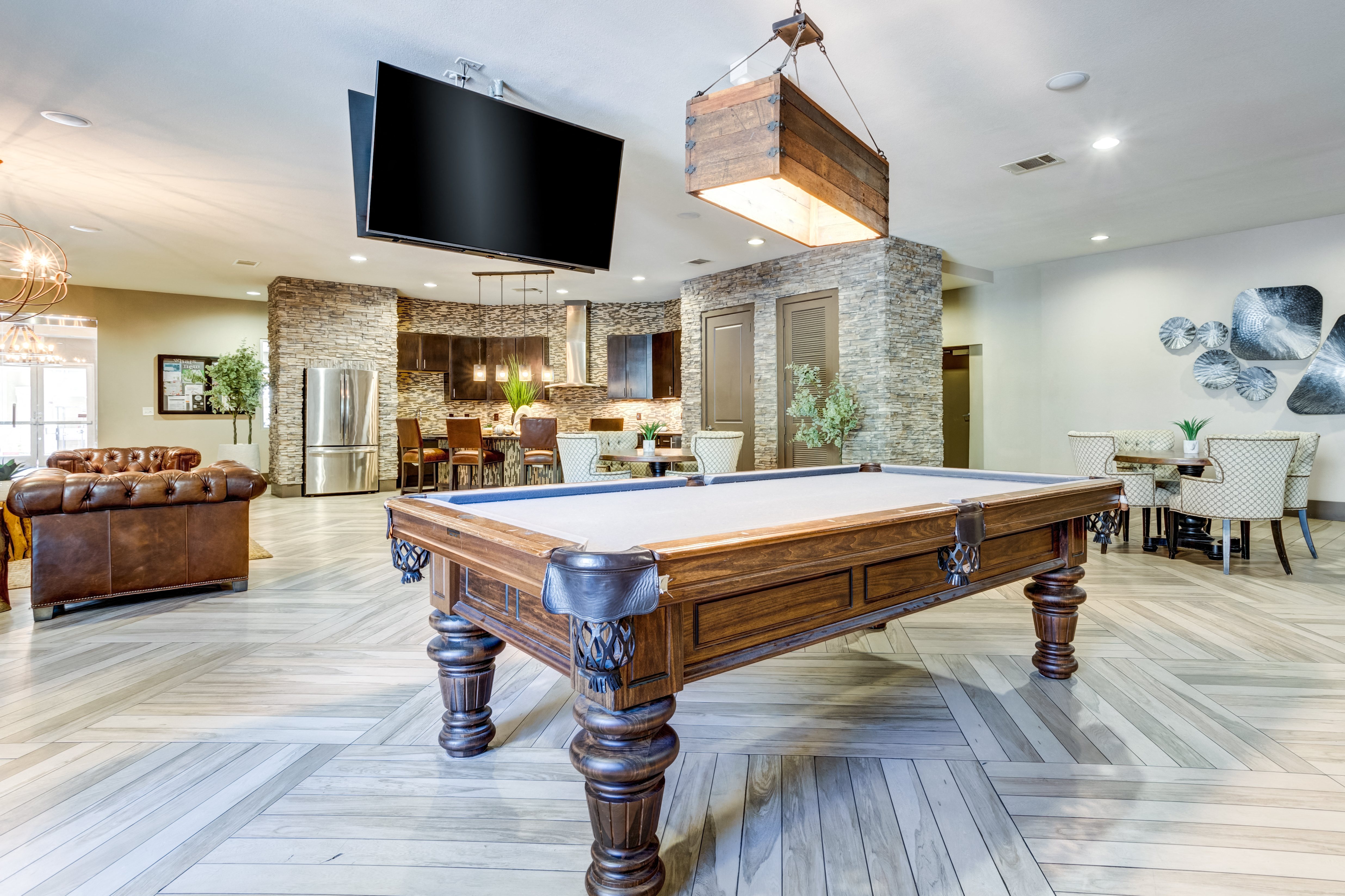 a pool table in a living room with a tv