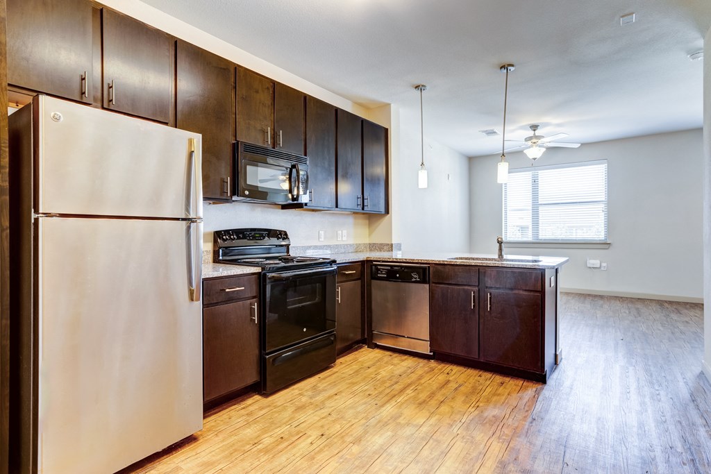 open kitchen and dining area floor plan with stainless steel appliances and wood floors