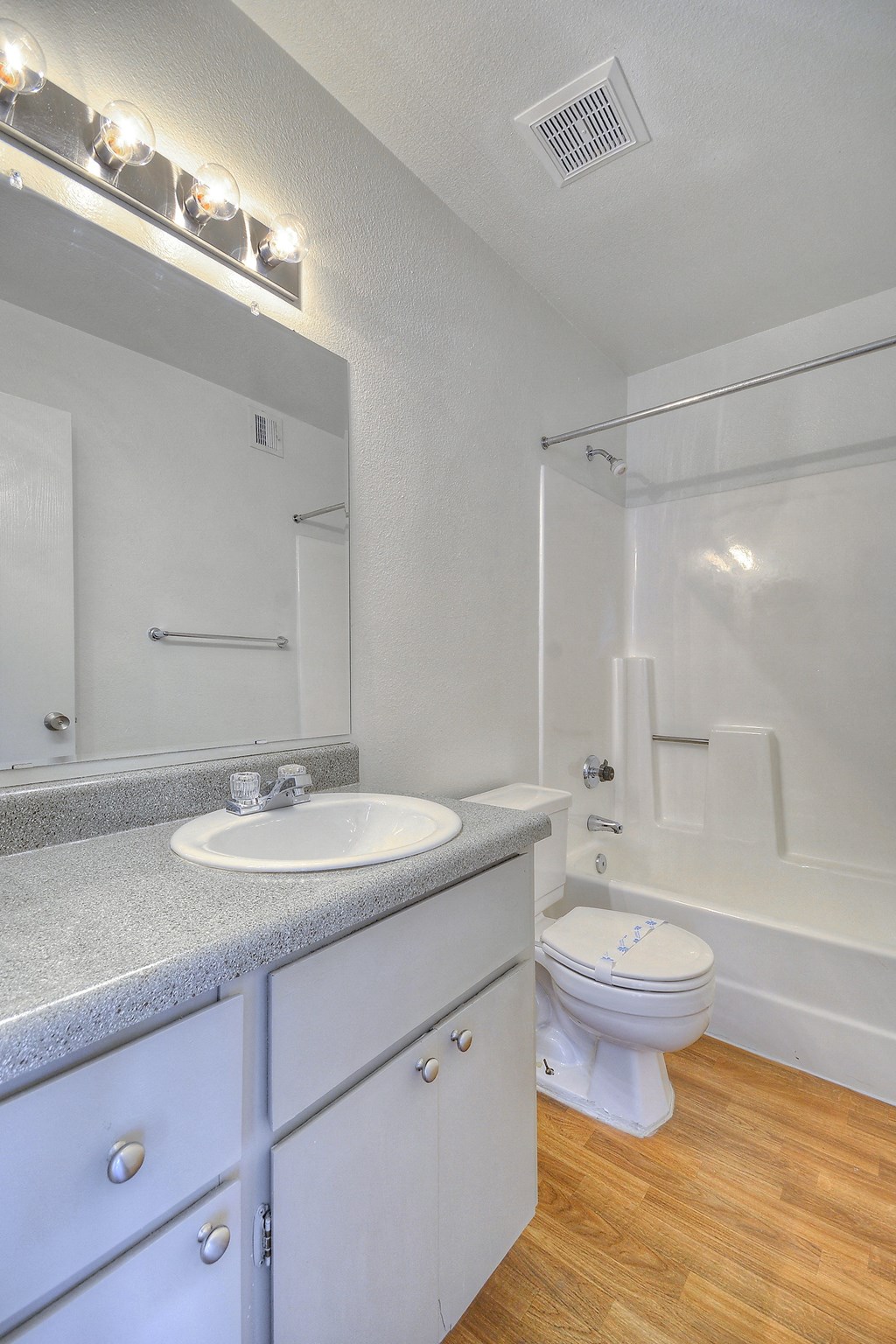 walk in bathroom with a toilet and shower