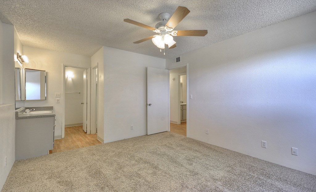 open bedroom area with attached bathroom