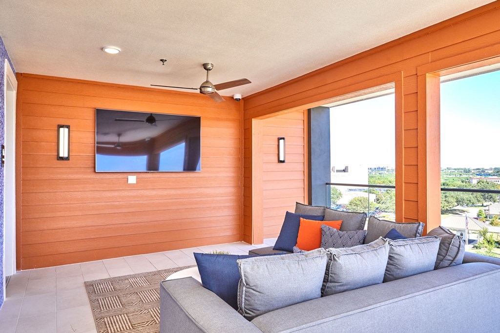 Rooftop Lounge with Large TV at Addison Medical Center Apartments, San Antonio, TX, 78229