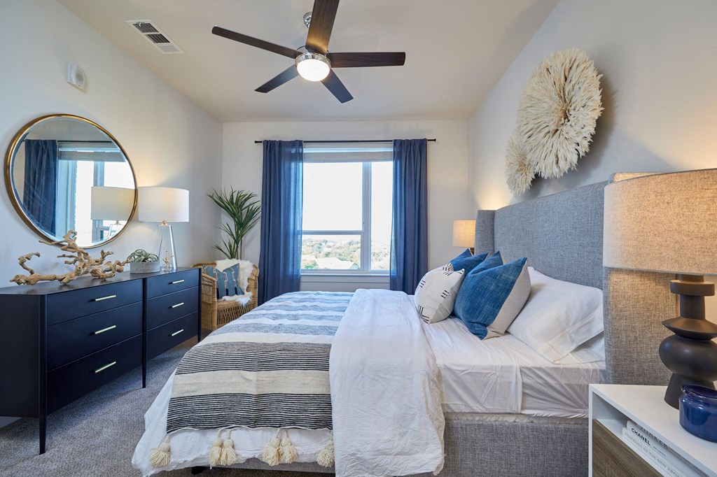 Nice size Bedroom with Window and Ceiling Fan at Addison Medical Center Apartments, Texas