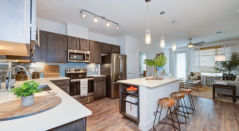 Open Floor Plan - Kitchen Island open to Living Room. at Addison Medical Center Apartments, San Antonio