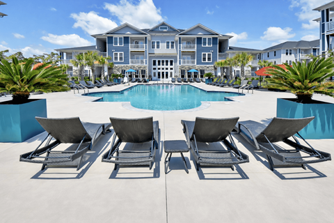 Pool with sun loungers at HAVEN POINTE AT CAROLINA FOREST APARTMENTS, Myrtle Beach, SC, 29579