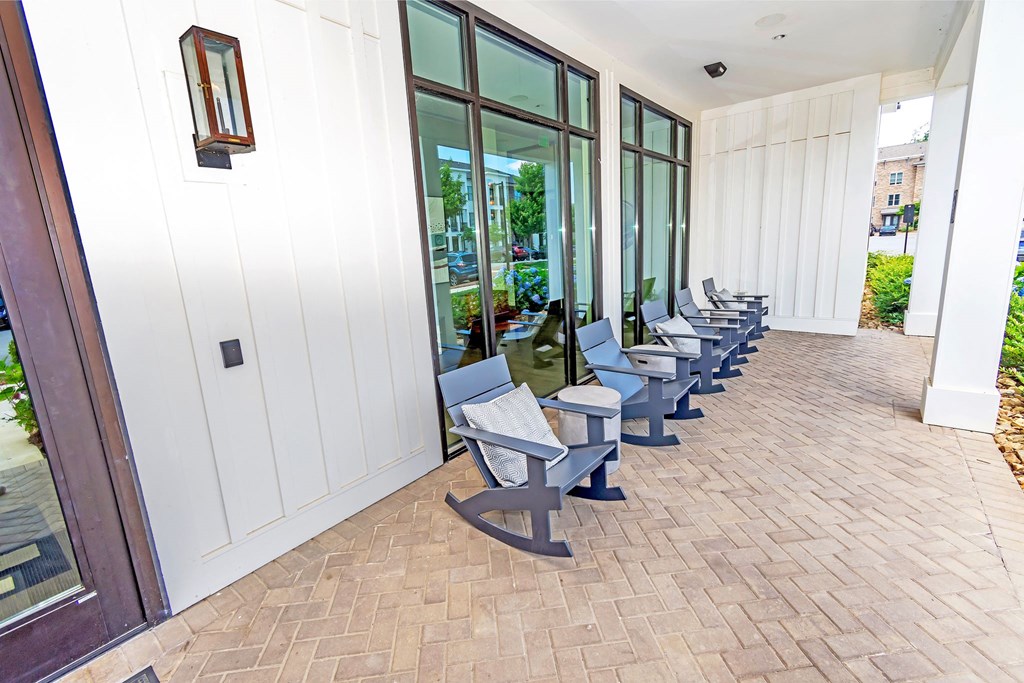 a row of blue chairs outside of a building
