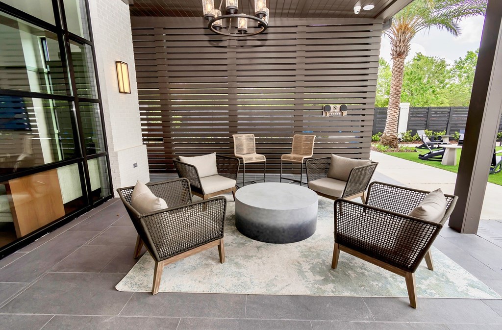 A patio with a table and chairs.