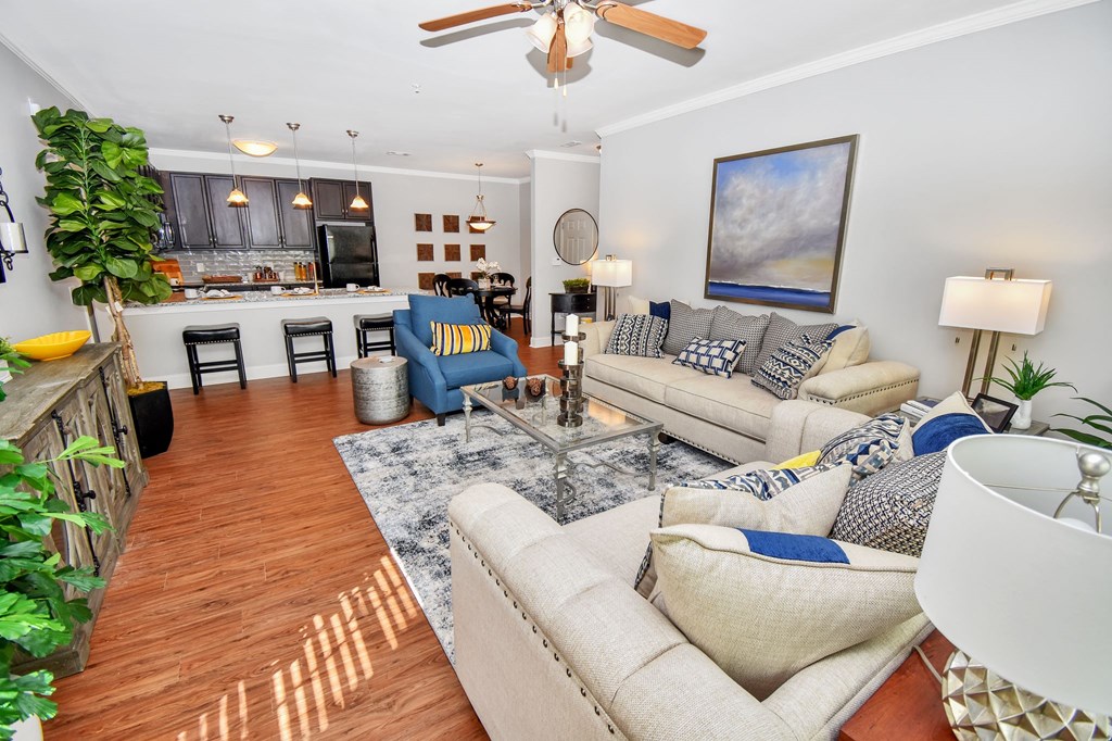 Riverstone Model 2 bedroom living room and view of kitchen