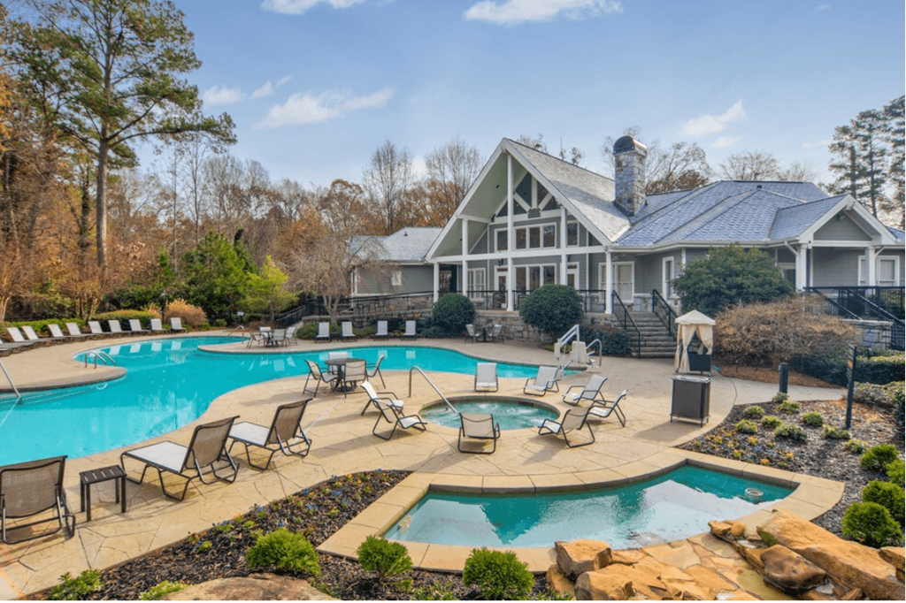 A large house with a pool in the backyard.