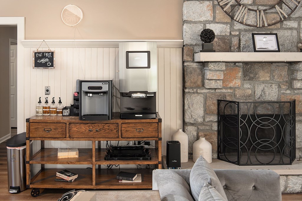 A clubroom with a fireplace