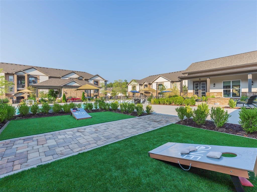 A area with aprtments and a well-maintained lawn.