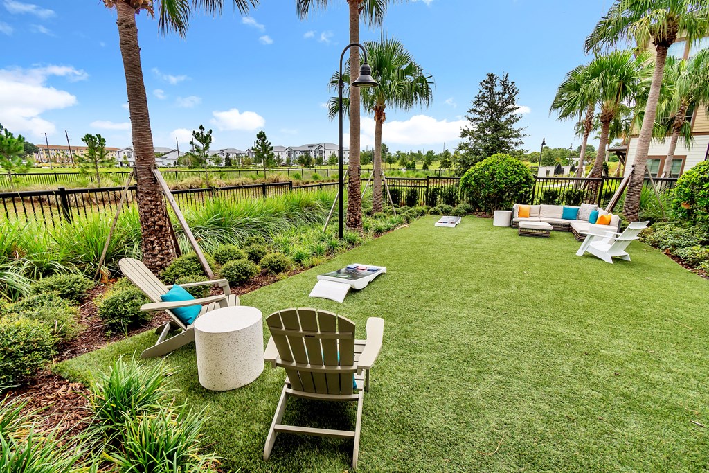 a courtyard with lawn chairs and hammocks