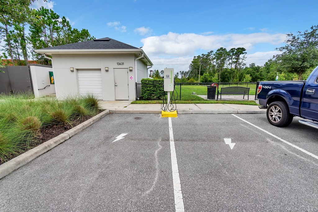 a truck parked in a parking lot next to a parking meter