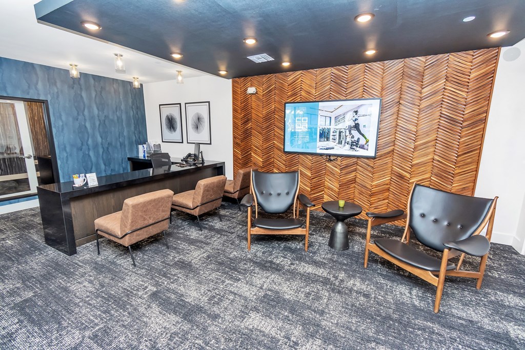 a room filled with furniture and a flat screen tv