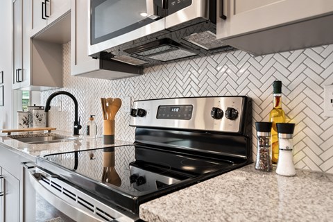 a kitchen with a stove and a sink