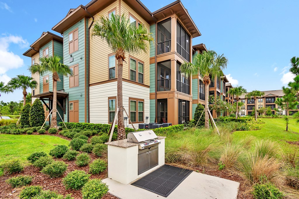 exterior apartment building  with a grill station in front