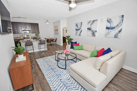 A living room with a white couch and a coffee table.