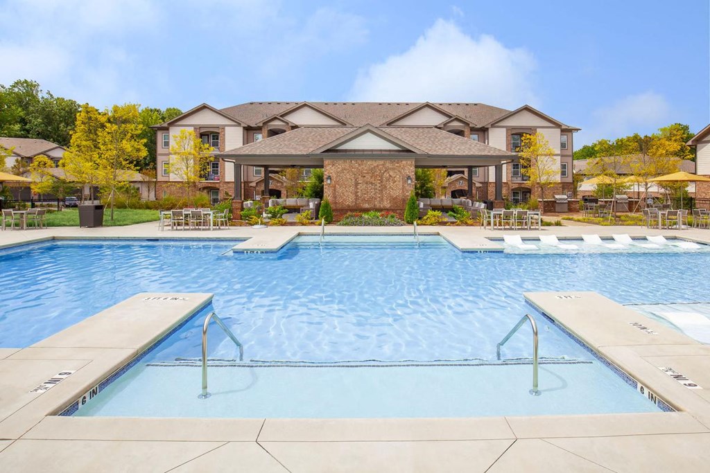 Gorgeous, resort-style swimming pool on a sunny day in One White Oak rentals in Cumming, GA