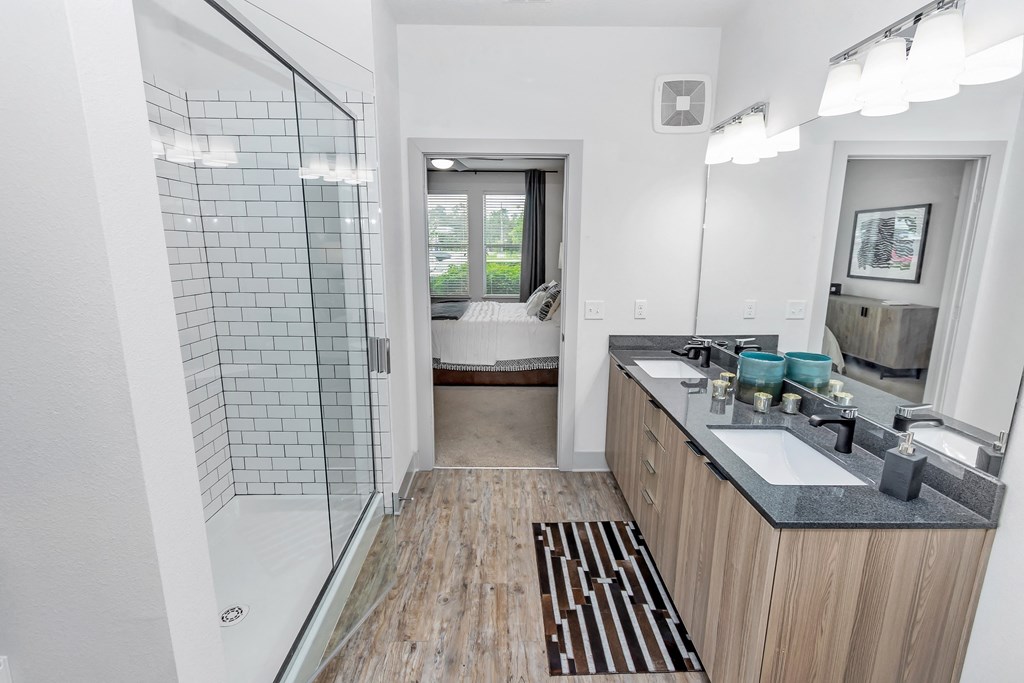 a bathroom with a shower and a sink