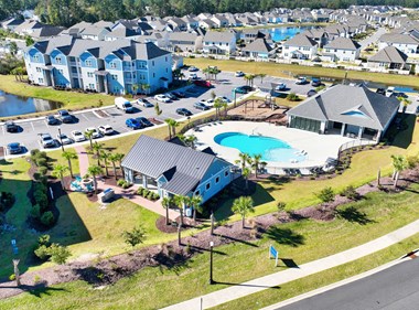 Aerial view of Grandview at Clear Pond’s apartments, clubhouse, pool, parking, and ponds