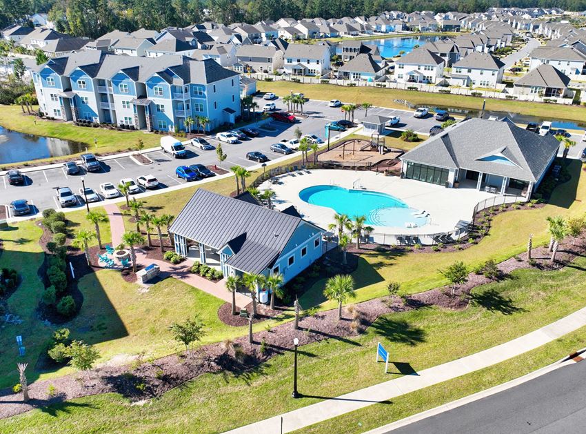 Aerial view of Grandview at Clear Pond’s apartments, clubhouse, pool, parking, and ponds - Photo Gallery 1
