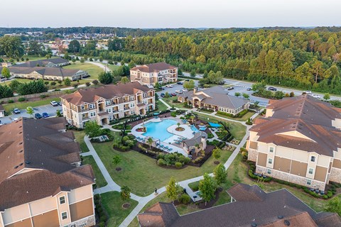 an aerial view of the resort with a swimming pool