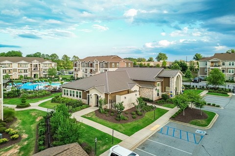 an aerial view of a neighborhood with houses and a swimming pool