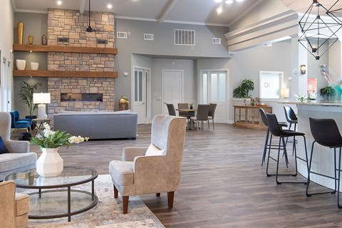 a clubhouse with a fireplace and a dining room