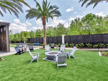 Dawson Park Apartments Pool side seating - Photo Gallery 3