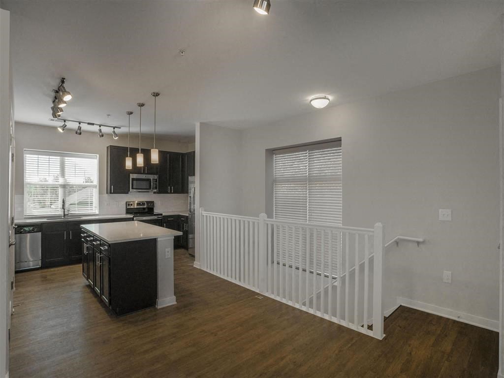 Luxury Vinyl Plank Flooring In Kitchen at Pointe at Prosperity Village Rental Homes in North Carolina