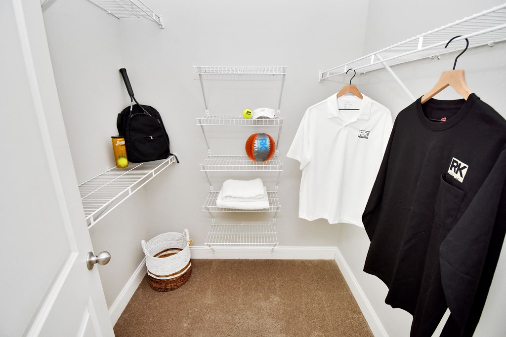 Riverstone Model Closet with t-shirts hanging