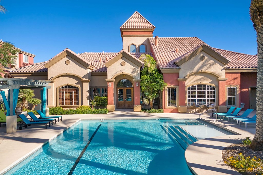 swimming pool with clubhouse in the background