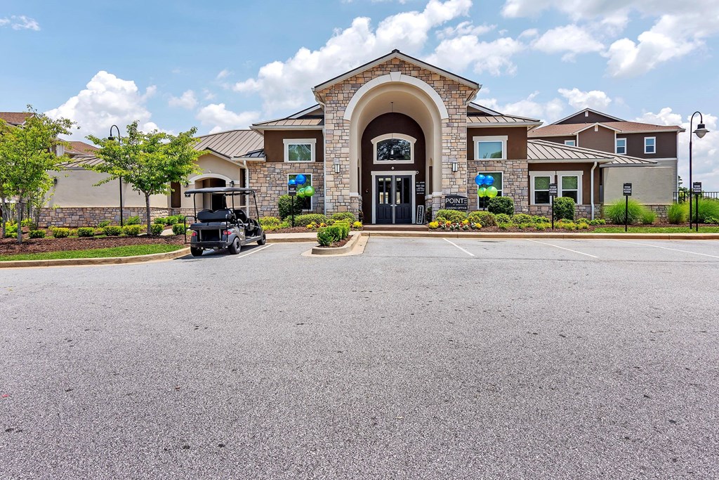 a large building with a golf cart parked in front of it
