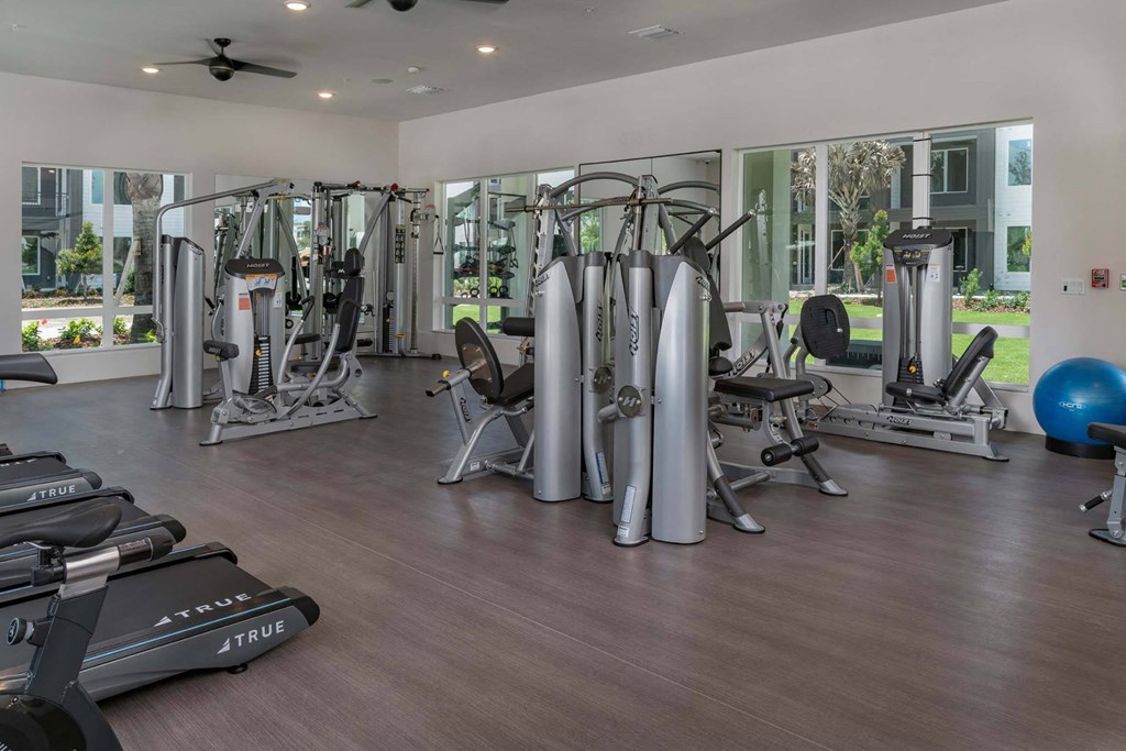 a room filled with lots of different types of exercise equipment