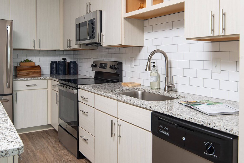 a kitchen with a sink and a counter top