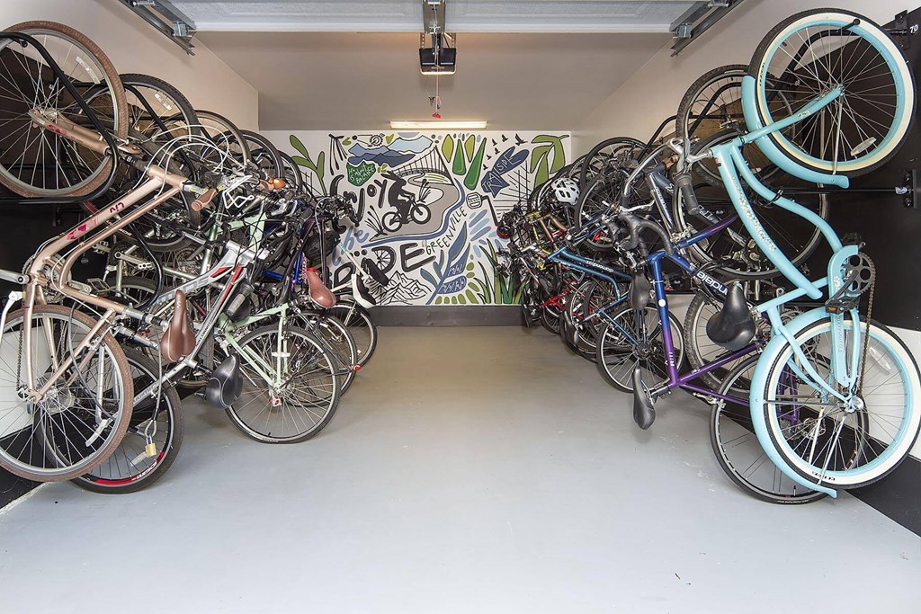 a bunch of bikes parked in a room