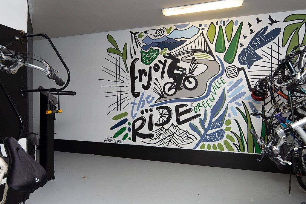 a bike room with art on the wall