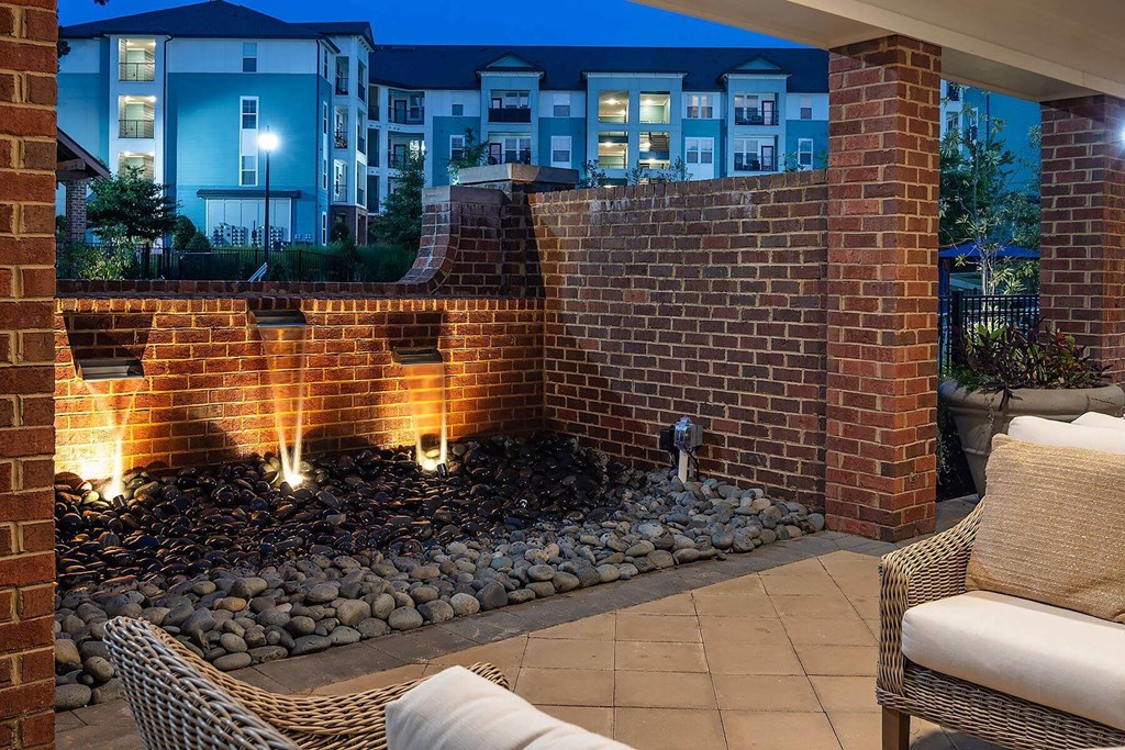 a water feature on a brick wall