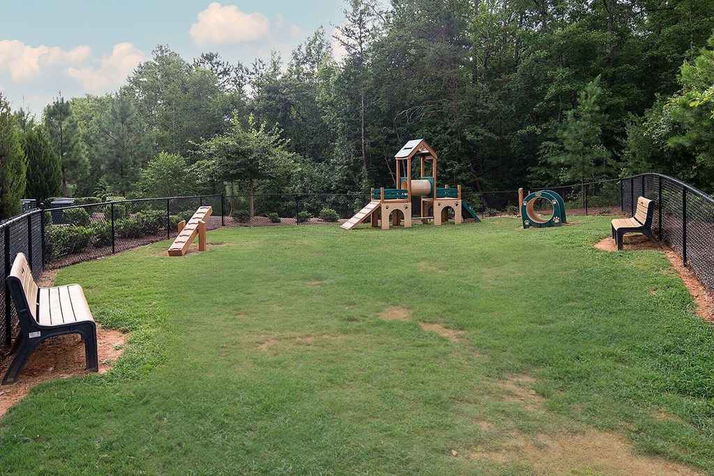 a dog park with a play yard and a pet playground