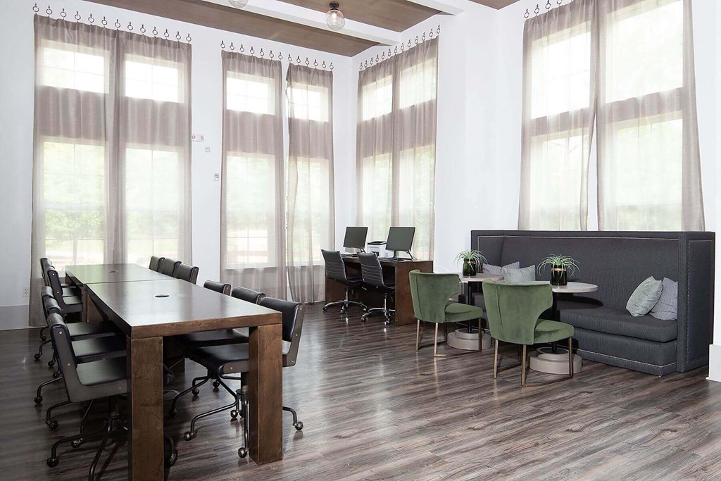 a conference room with a table and chairs