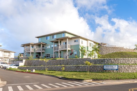 A building with a sign that says "Water Ridge" in front of it.