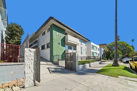 A green and white building with the number 406 on it.