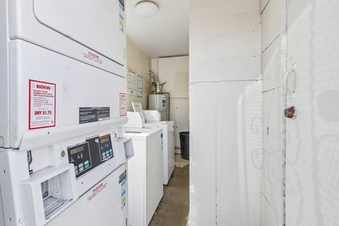 A white refrigerator with a warning label on the door.