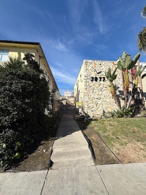 A stone building with the number 3871 on it.