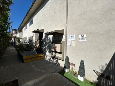 A building with a sign that says "NO SHIFTING" on the wall.