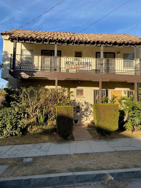 A house with a balcony and a sign that says "NO LEASING".