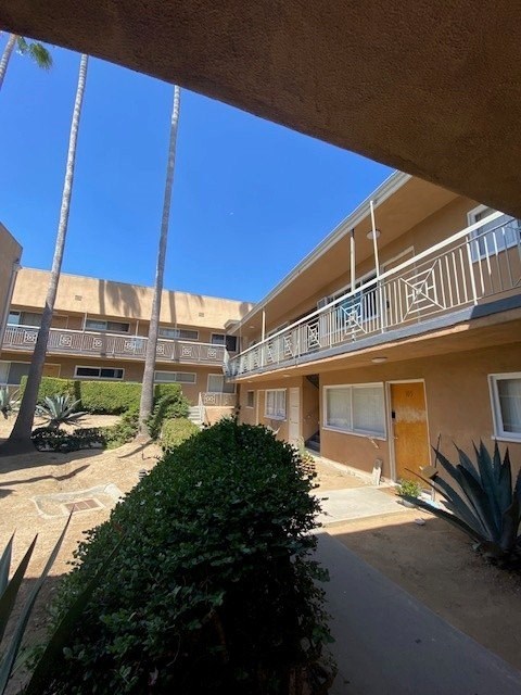 A sunny day at the apartment complex with clear blue skies.